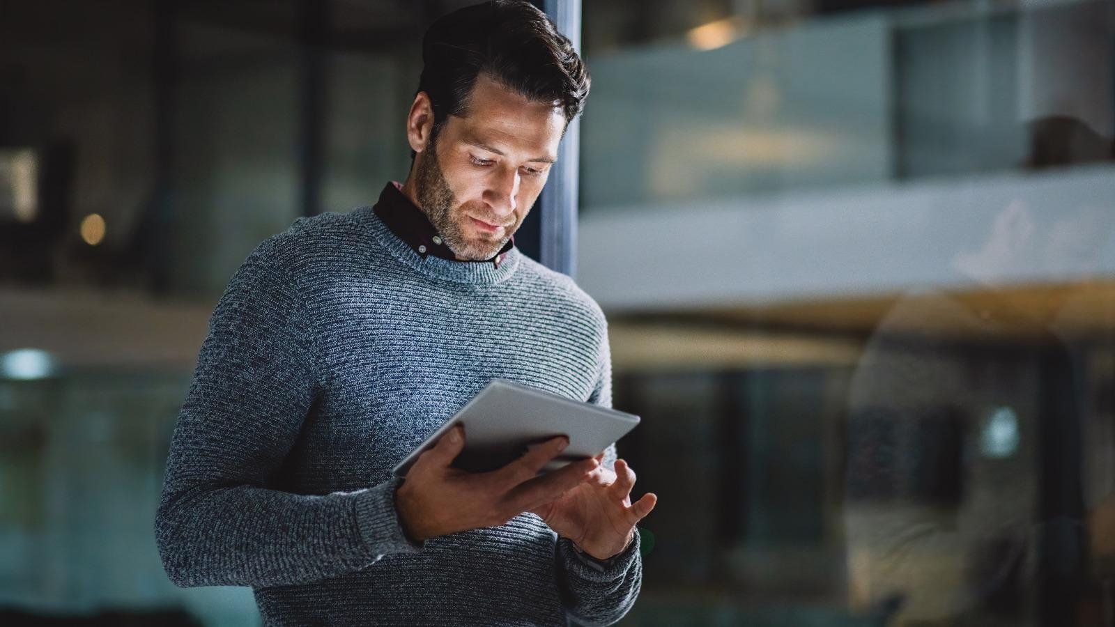 Businessman uses tablet