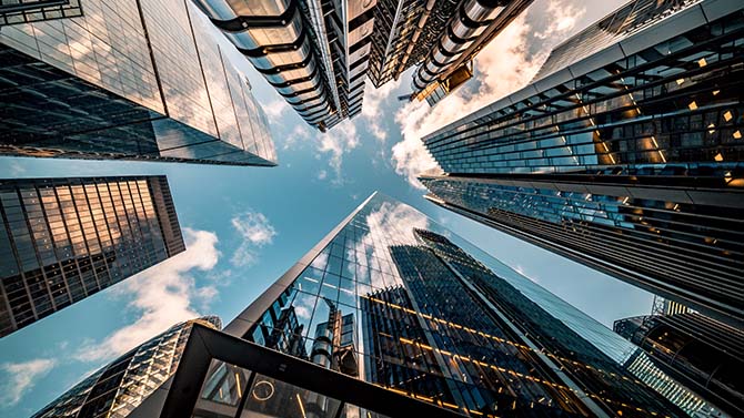 Highly detailed abstract wide angle view up towards the sky in the financial district of London City.