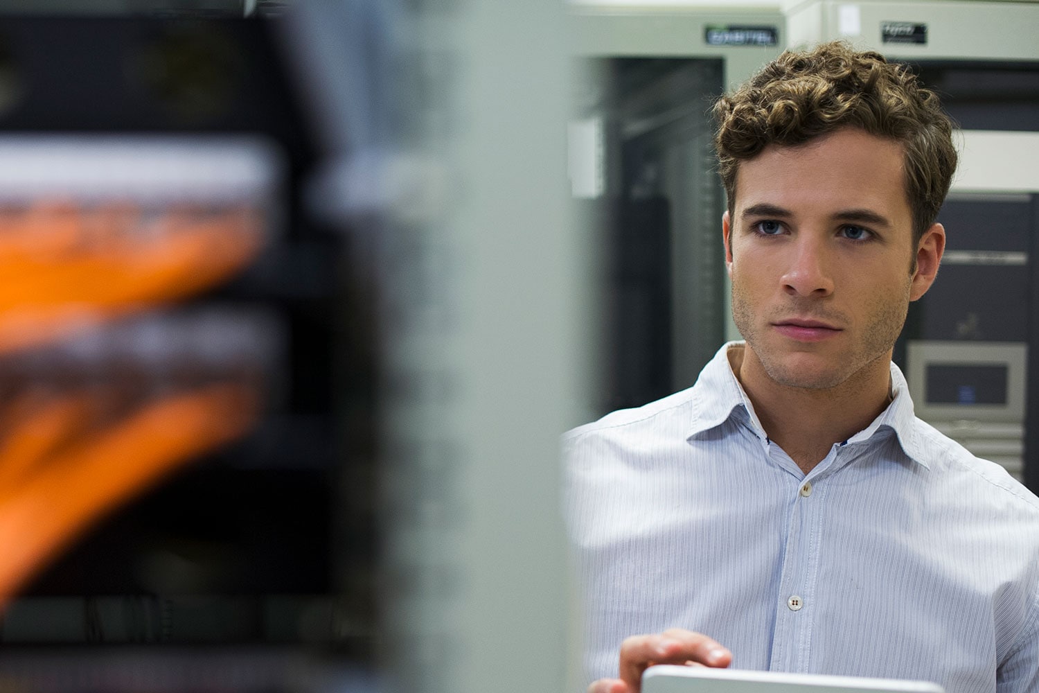 Young man in server room
