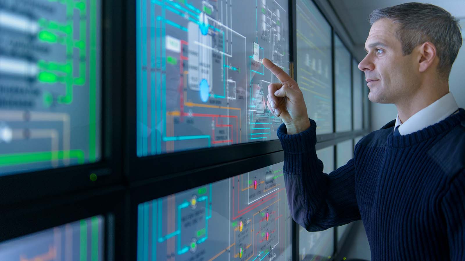Man working on a big screen