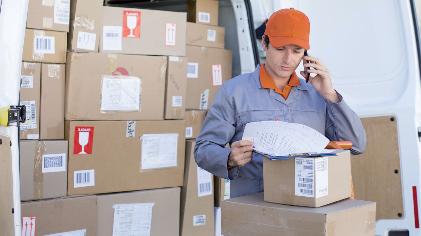 Parcel delivery person making a delivery