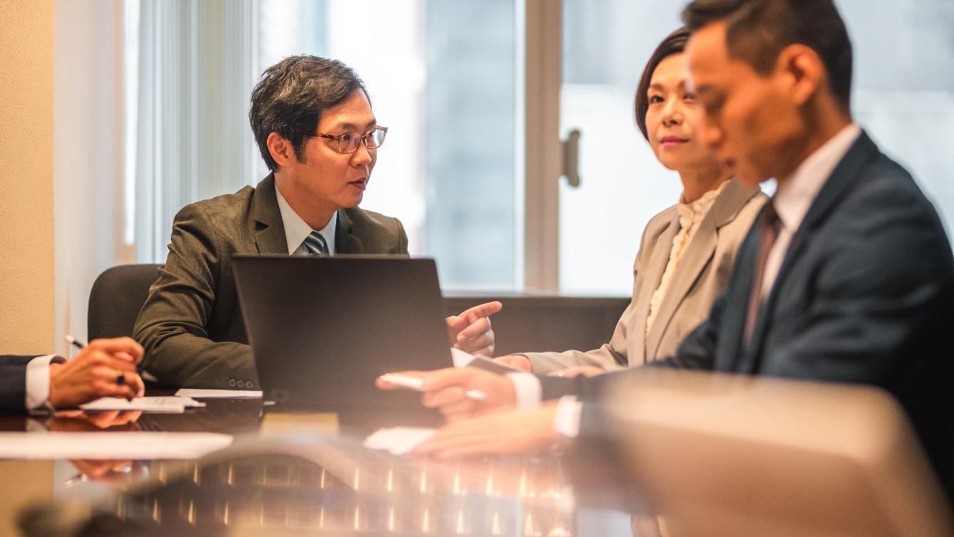 Chinese business people in meeting